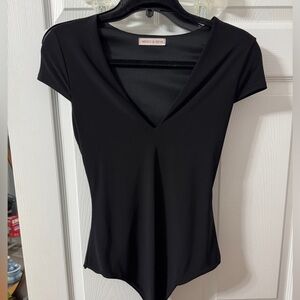 Black V-Neck Bodysuit by Merci & Reve